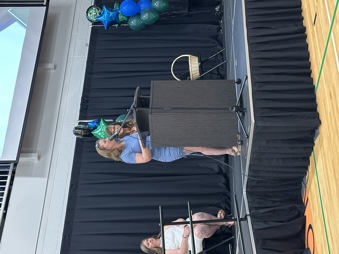 Shannon Gardi at the podium-graduation 2025-26