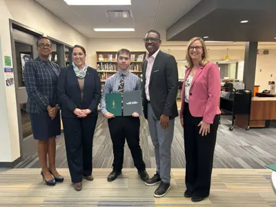 Vito Iafrate receiving the Prime Ministers Award for Excellence from the Minister of Parlaiment Hon.Sima Acan. She is handing him the certificate.Vito is standing with Ms.Acan as well as Director of Education Curtis Ennis, Superintendent Elanor McIntosh and Trustee Carole Baxter